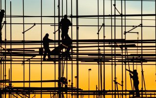 Construction site worker performing tasks at height safely